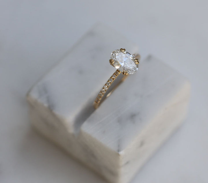 Oval solitaire lab grown diamond ring side profile in gold setting