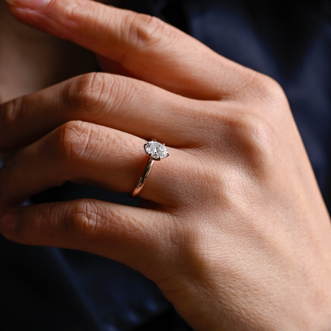 Oval solitaire engagement ring viewed from the side