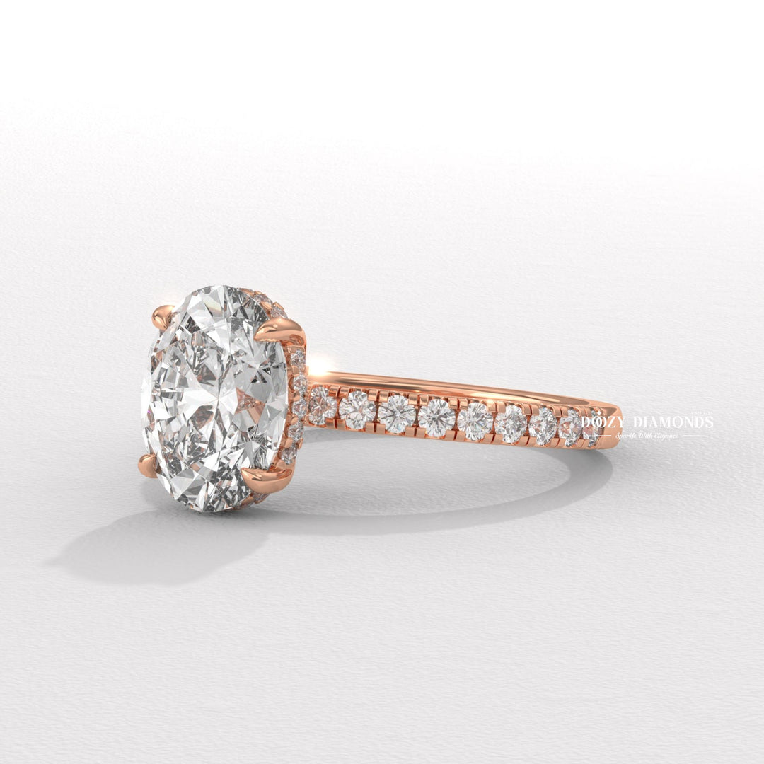 Oval hidden halo lab grown diamond ring fitted on finger