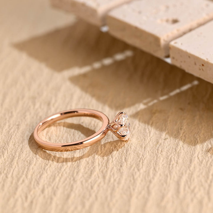 Close-up of oval cut center diamond in solitaire engagement ring