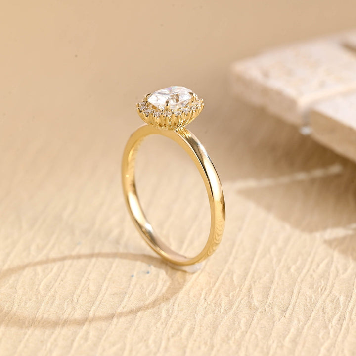 Oval solitaire engagement ring close-up highlighting diamond sparkle