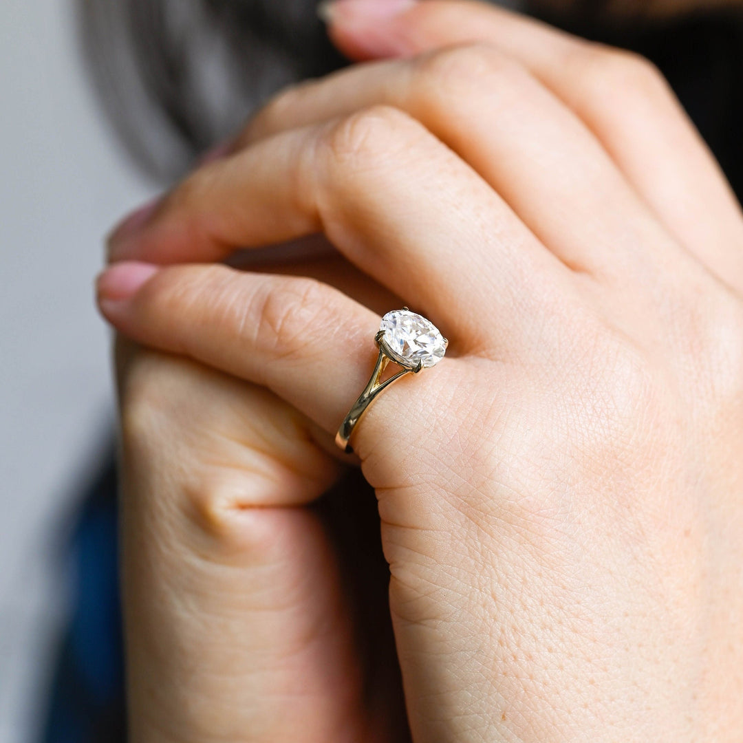 Profile view of oval cut split shank engagement ring band