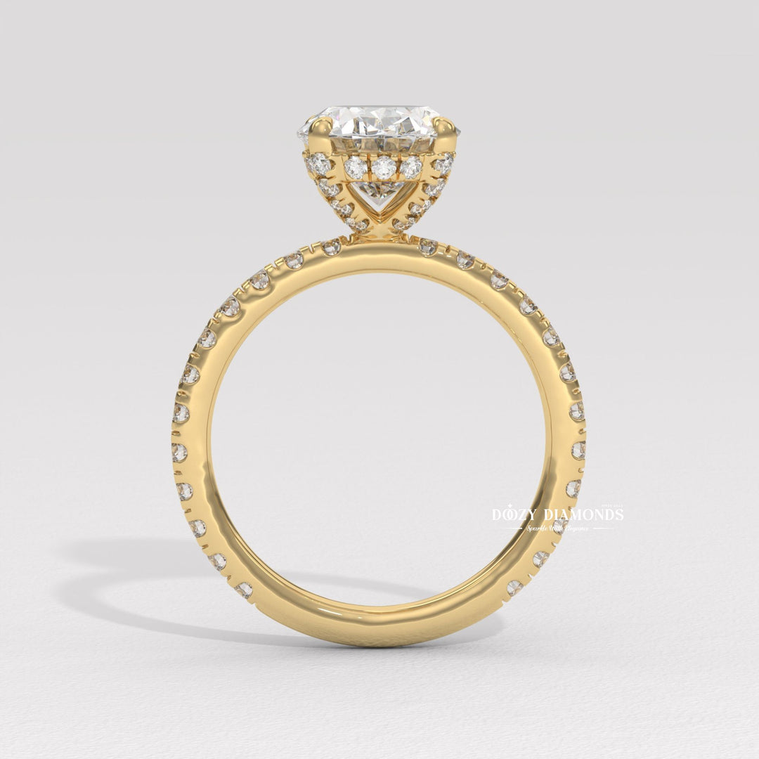 Detailed close-up of oval hidden halo diamond engagement ring