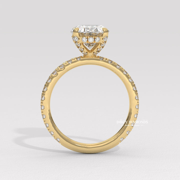 Detailed close-up of oval hidden halo diamond engagement ring