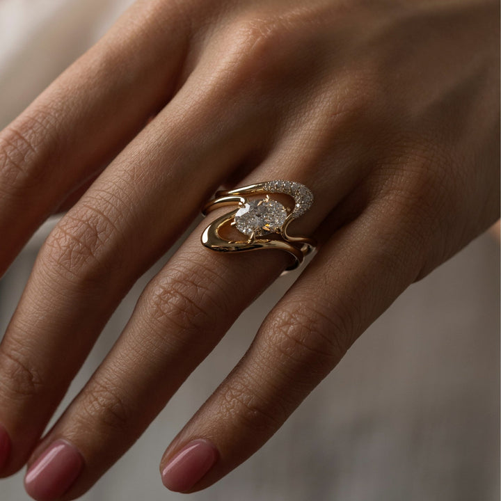 Oval cut solitaire engagement ring with IGI certified center diamond