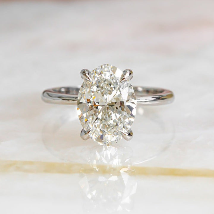 Shop oval hidden halo lab grown diamond engagement ring