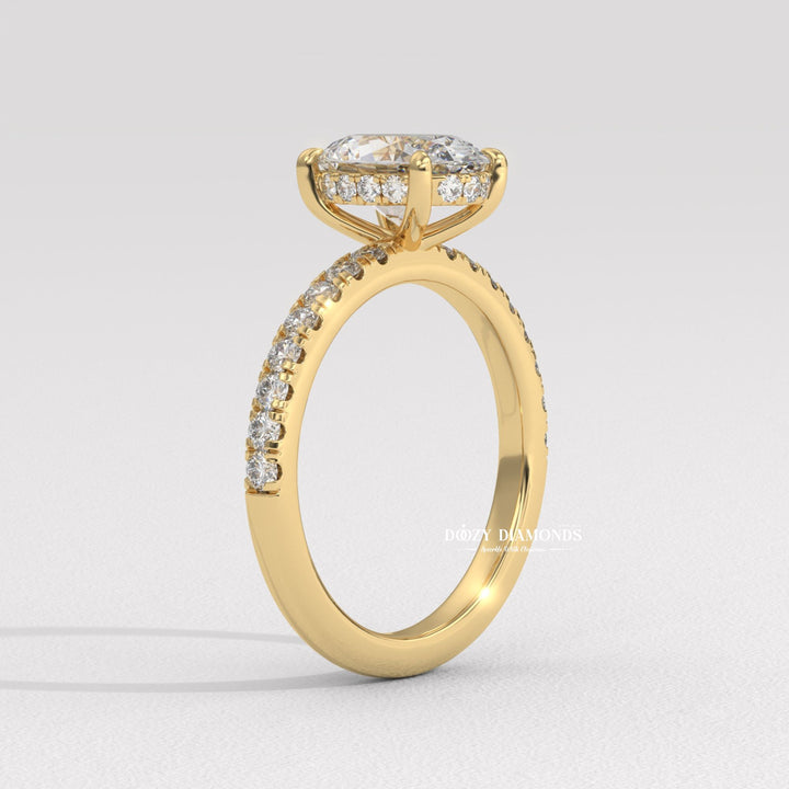 Angled view of oval cut diamond in hidden halo setting
