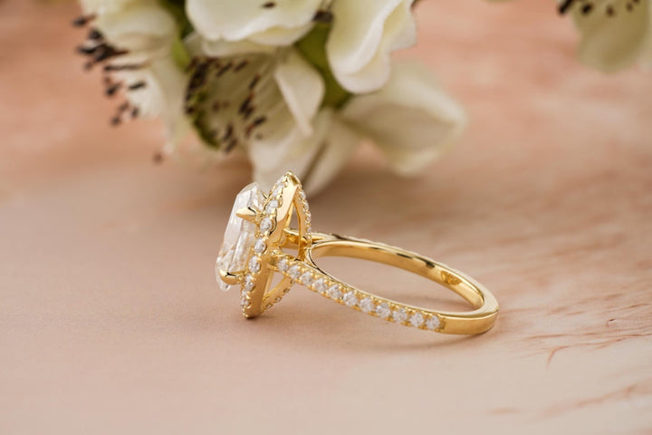 Oval pave engagement ring photographed in natural light