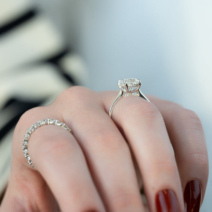 IGI certified oval cut diamond in hidden halo engagement ring setting