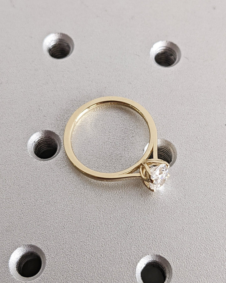 Detailed close-up of oval solitaire diamond engagement ring