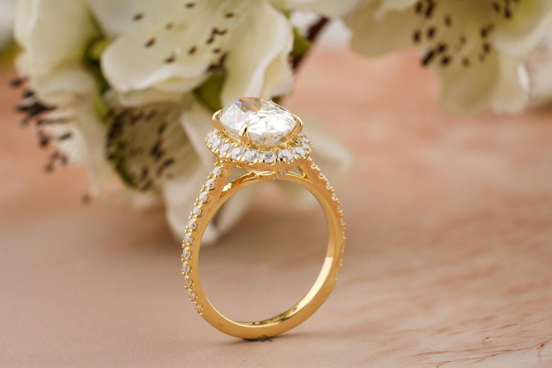 Oval pave engagement ring finished in polished solid gold