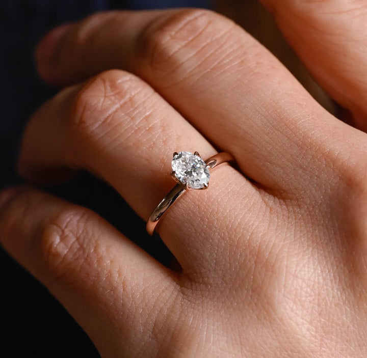 Side angle of oval solitaire diamond engagement ring