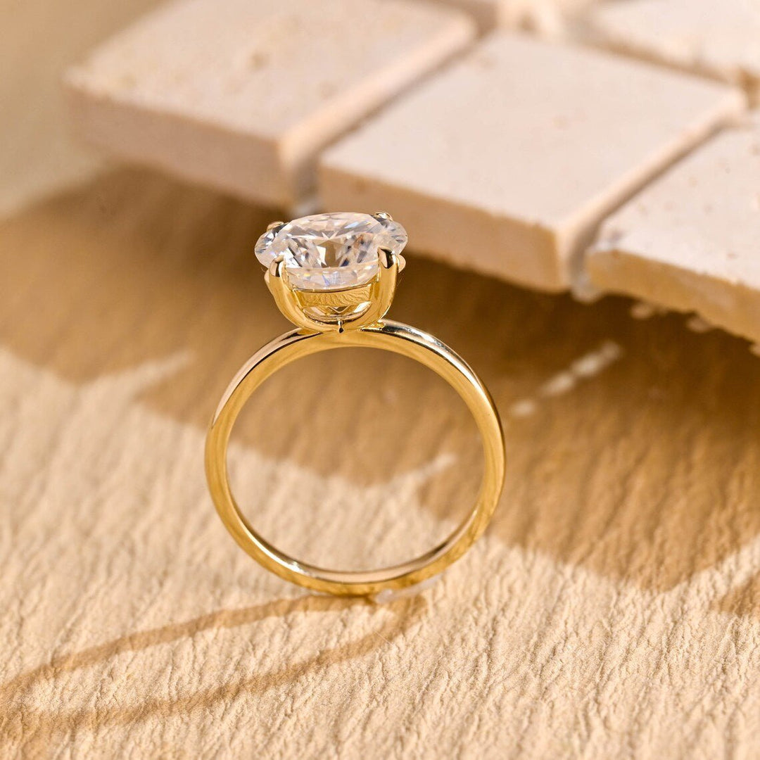 Macro shot of oval cut diamond facets in east west ring setting