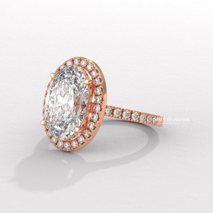 Oval halo engagement ring offered in gold and platinum