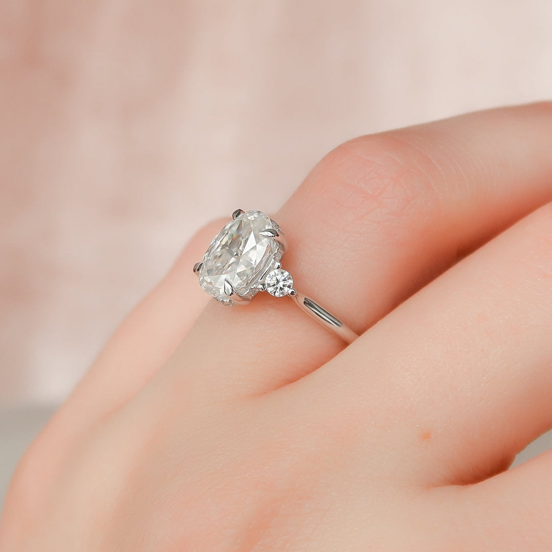 Oval cut three stone engagement ring with IGI certified center diamond