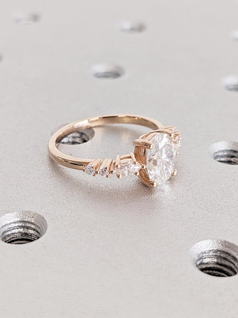 Oval cluster engagement ring finished in polished solid gold