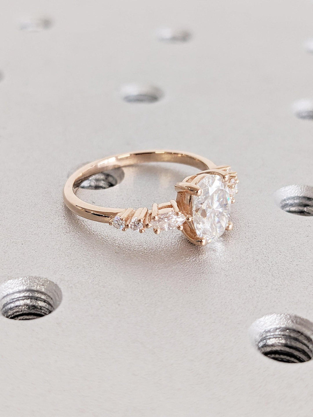 Oval cluster engagement ring finished in polished solid gold