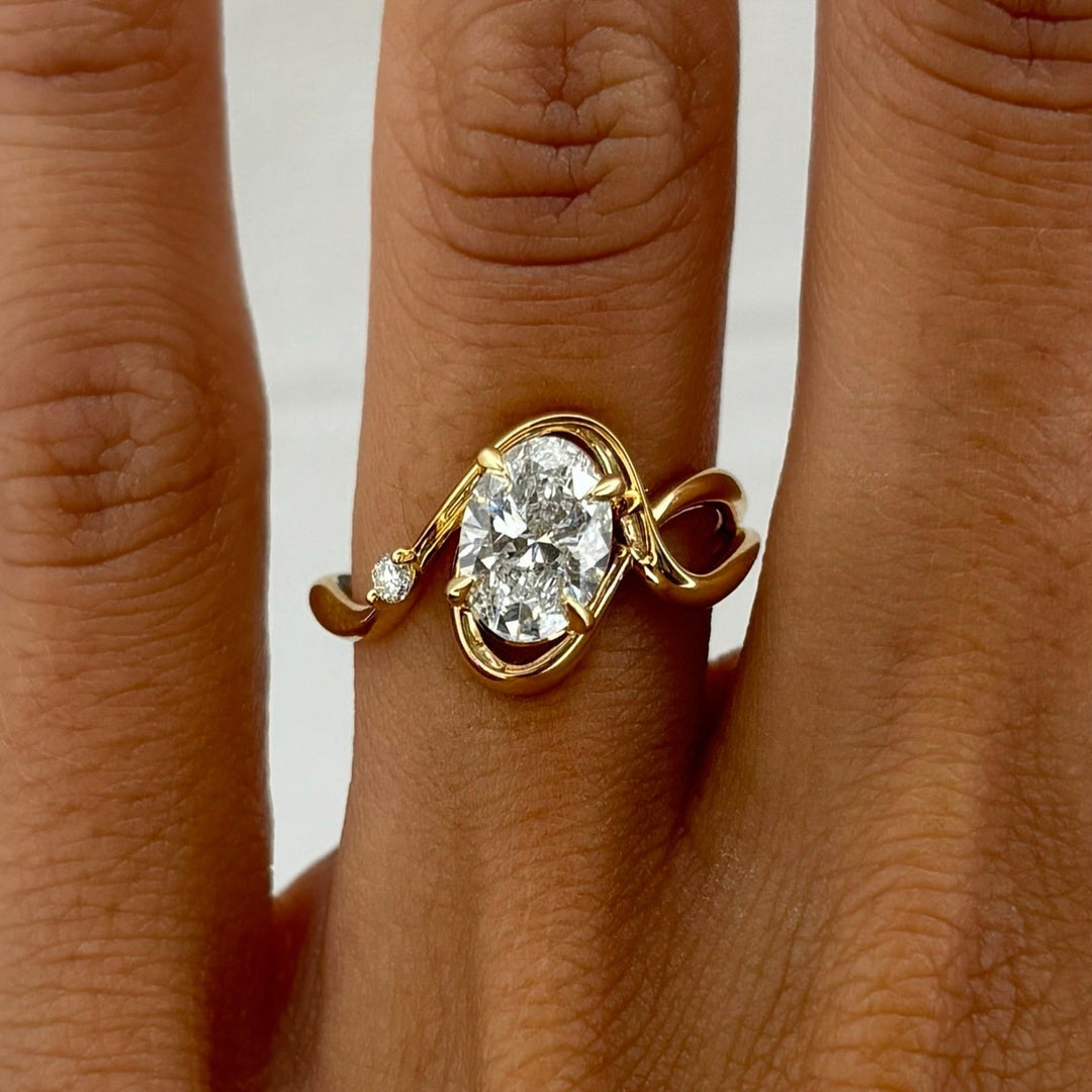 Oval cut solitaire engagement ring with IGI certified center diamond