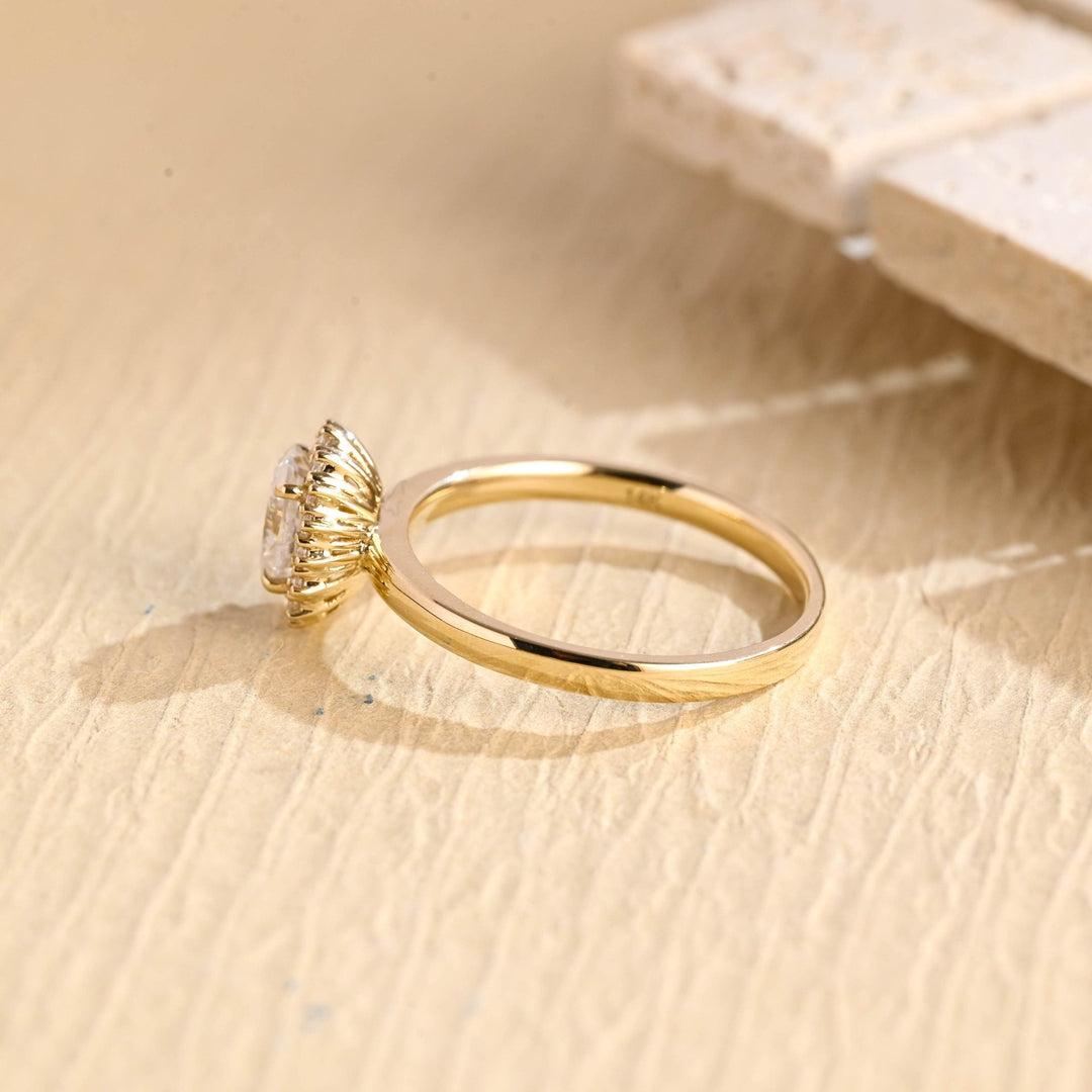 Close-up of oval cut center diamond in solitaire engagement ring