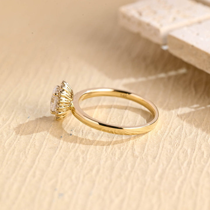 Close-up of oval cut center diamond in solitaire engagement ring