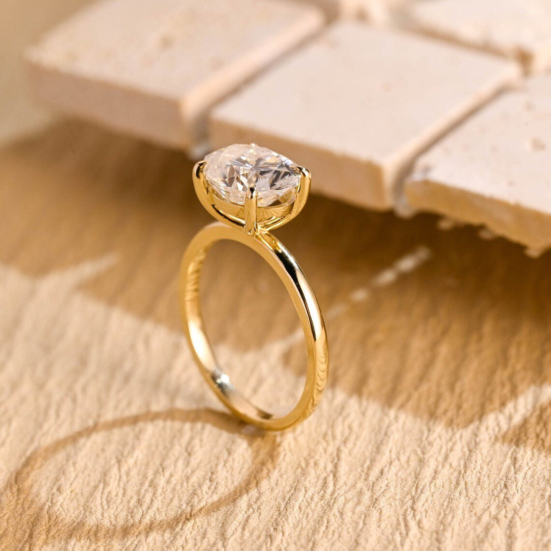 Detailed close-up of oval east west diamond engagement ring