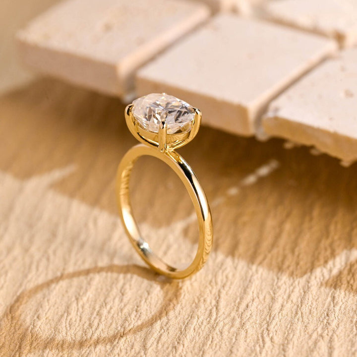 Detailed close-up of oval east west diamond engagement ring