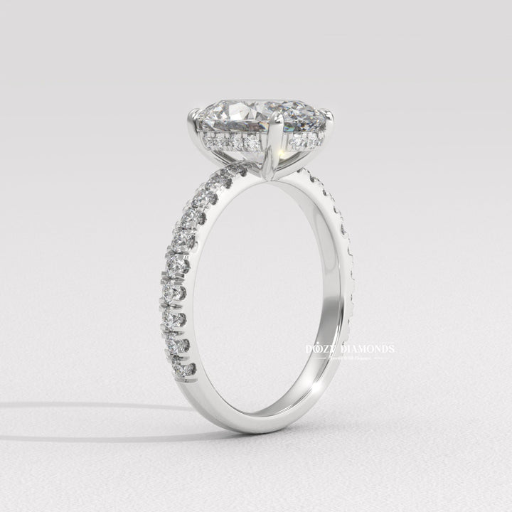 Side angle of oval hidden halo diamond engagement ring