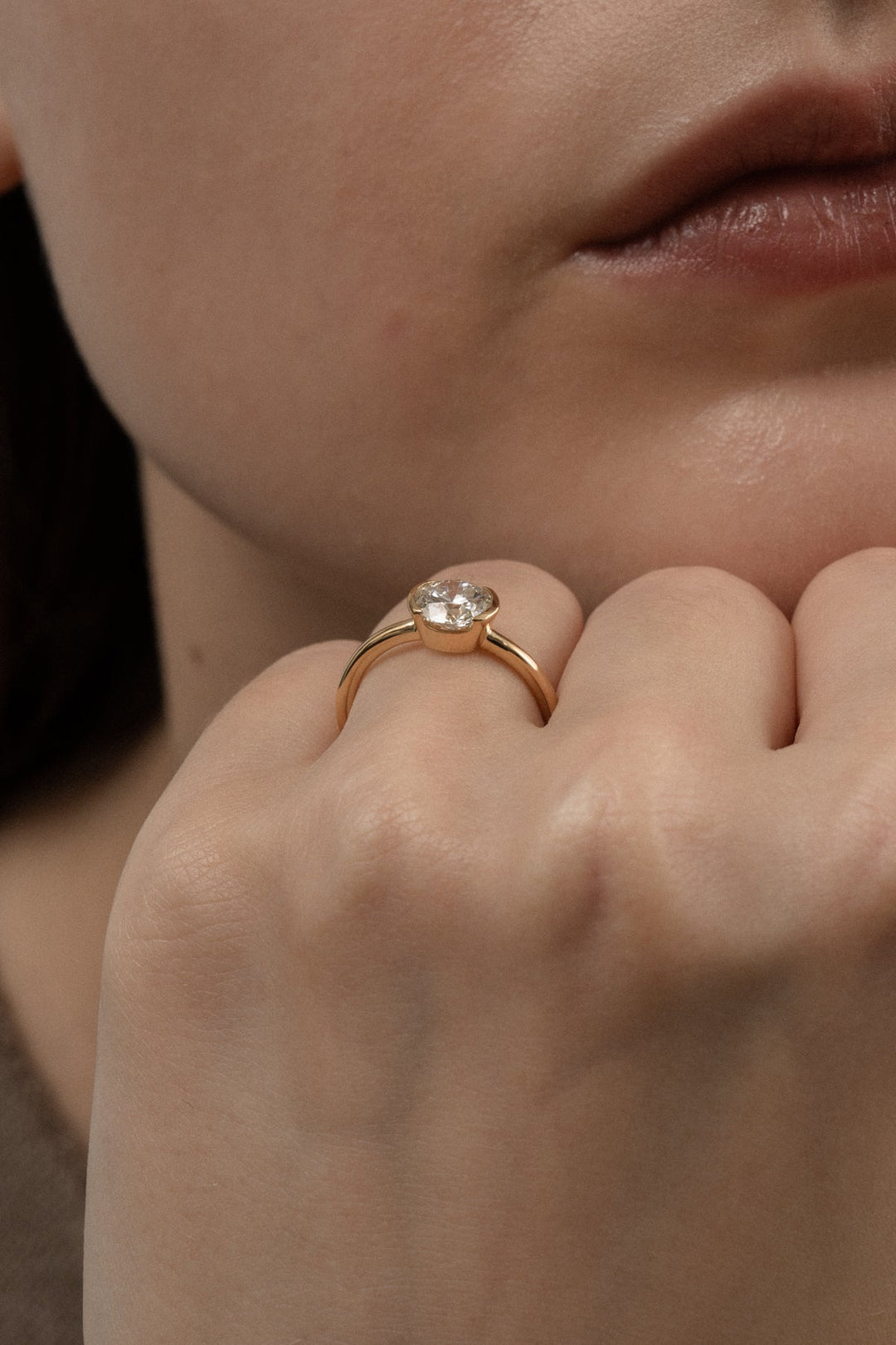 Top-down view of round cut bezel engagement ring