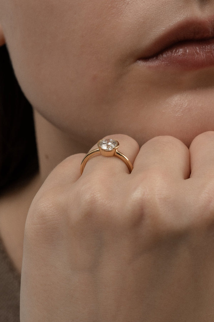 Top-down view of round cut bezel engagement ring