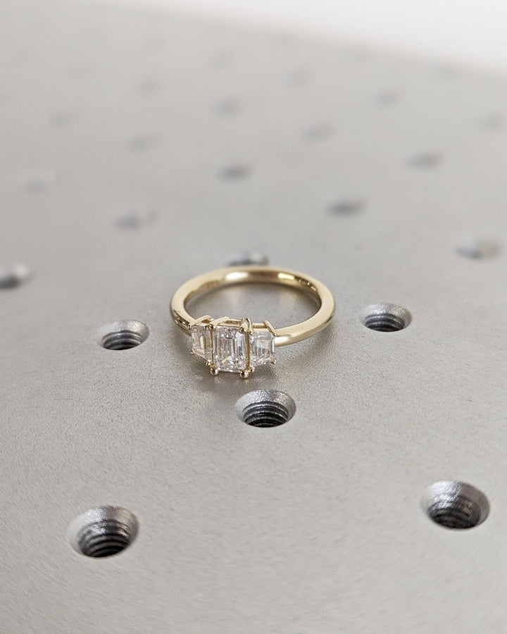Close-up of emerald cut center diamond in solitaire engagement ring