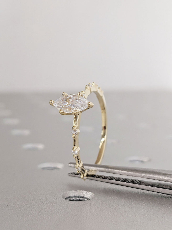Marquise pave engagement ring offered in gold and platinum