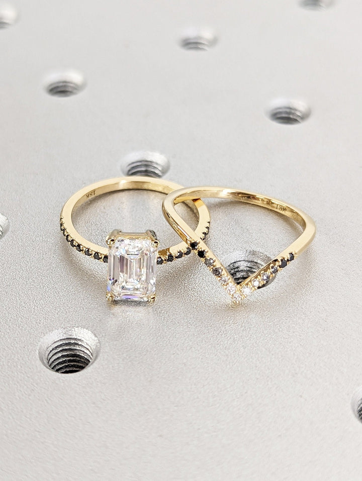 Detailed close-up of emerald pave diamond engagement ring