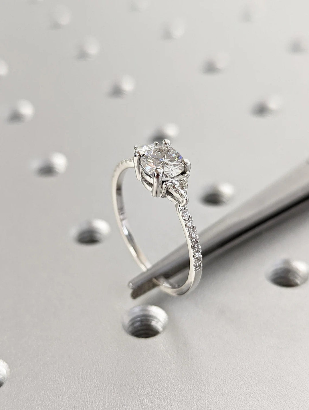 Round cut engagement ring side view showing band detail