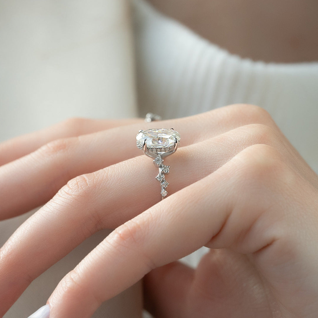 Oval hidden halo ring set with an IGI graded diamond
