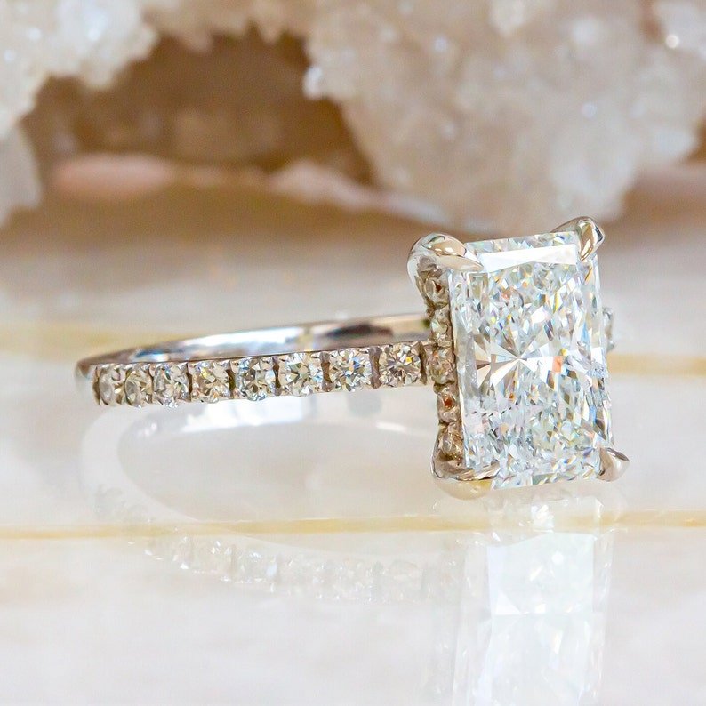 Radiant hidden halo lab grown diamond ring side profile in gold setting