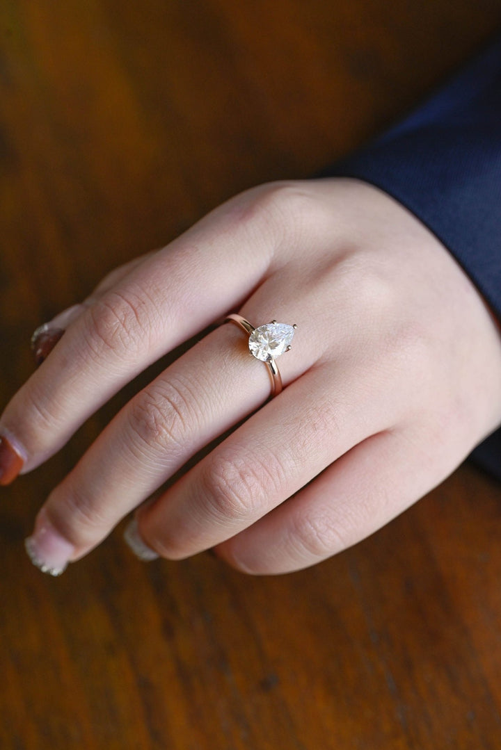 Classic pear hidden halo engagement ring crafted for everyday wear