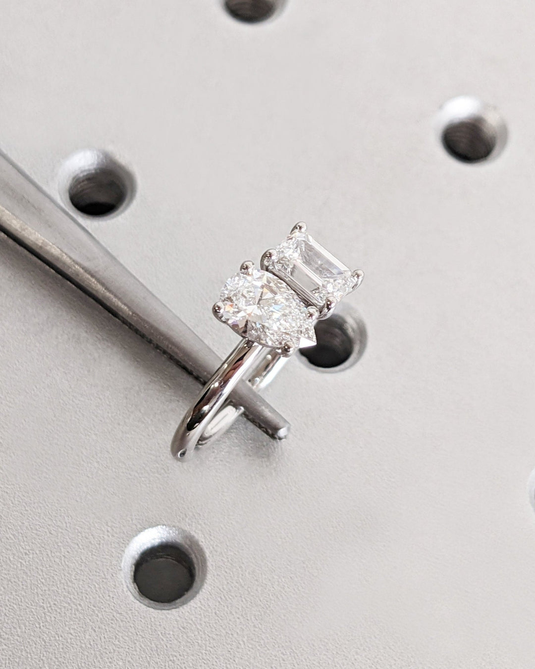 Macro shot of pear cut diamond facets in solitaire ring setting