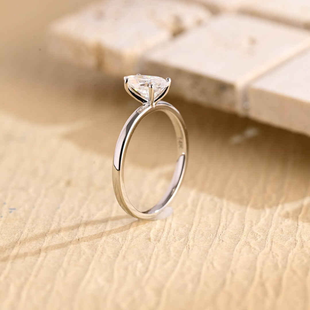 Premium pear cut solitaire engagement ring crafted in solid gold