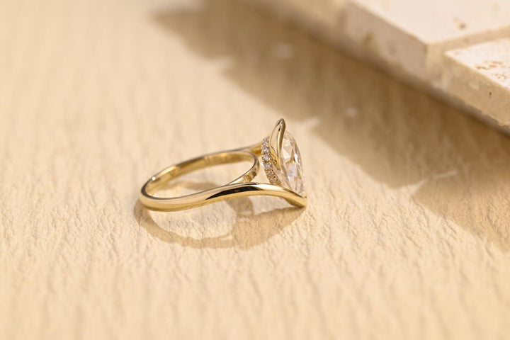 Pear cut engagement ring side view showing band detail