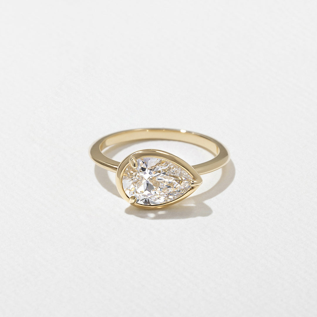 1.0CT Bezel Set Pear E - VS Lab Grown Diamond Ring With Unique Curved Band - Doozy Diamonds