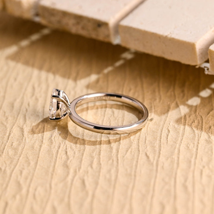 Fine craftsmanship detail on pear solitaire engagement ring