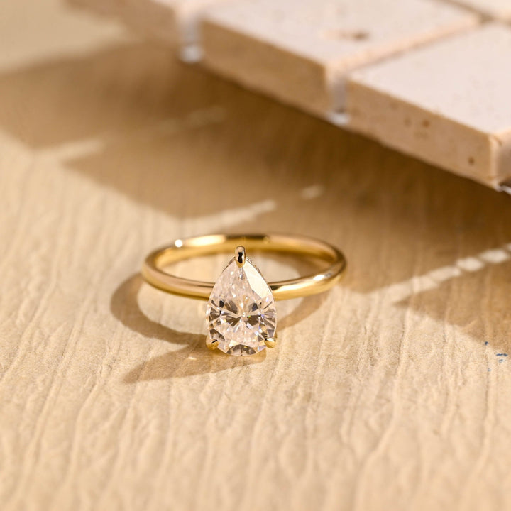 1.0CT pear cut hidden halo engagement ring available to buy now