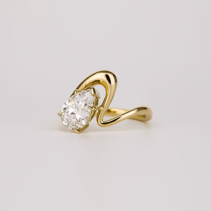 Pear solitaire engagement ring close-up showing high clarity diamond clarity