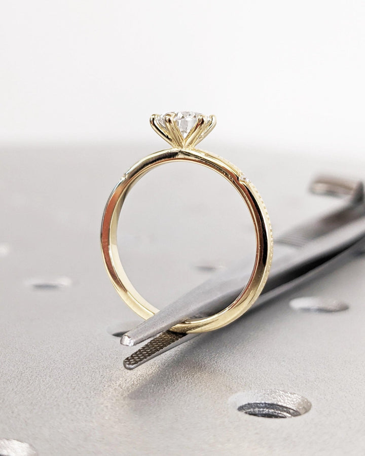 Pear solitaire engagement ring with certified lab grown diamond