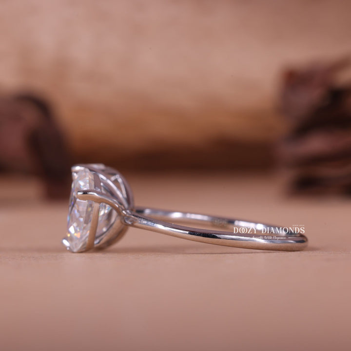 Angled view of pear cut diamond in solitaire setting