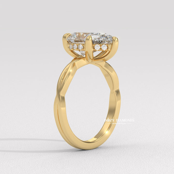 Detailed close-up of pear solitaire diamond engagement ring