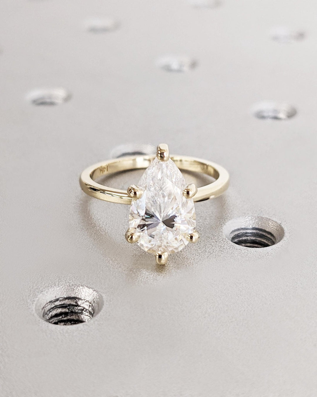 Pear solitaire diamond engagement ring available in multiple metals