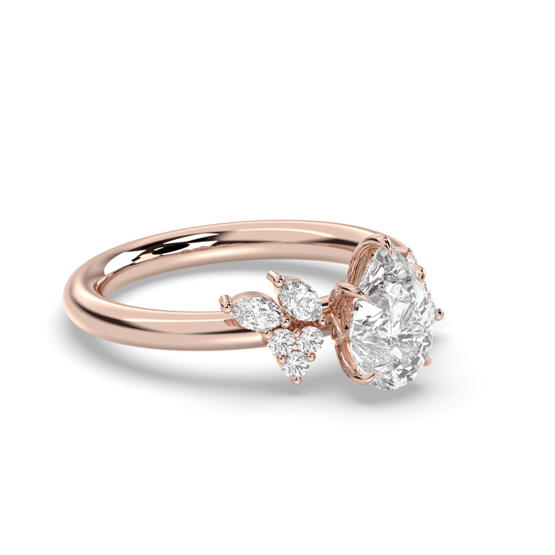 Pear cluster diamond ring displayed on jewelry stand