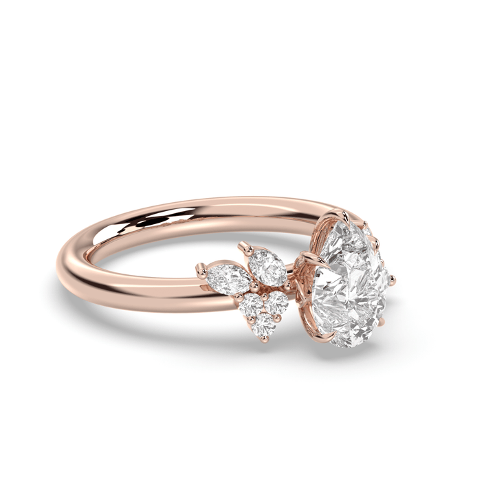 Pear cluster diamond ring displayed on jewelry stand
