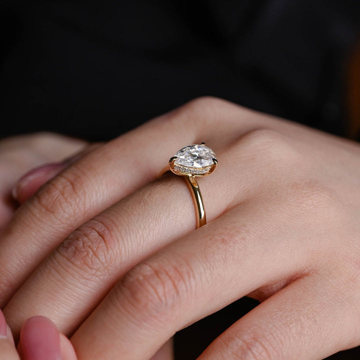 Angled view of pear cut diamond in hidden halo setting